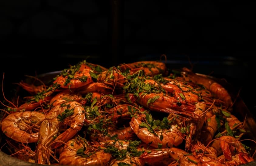 Seasoned shrimp garnished with fresh herbs